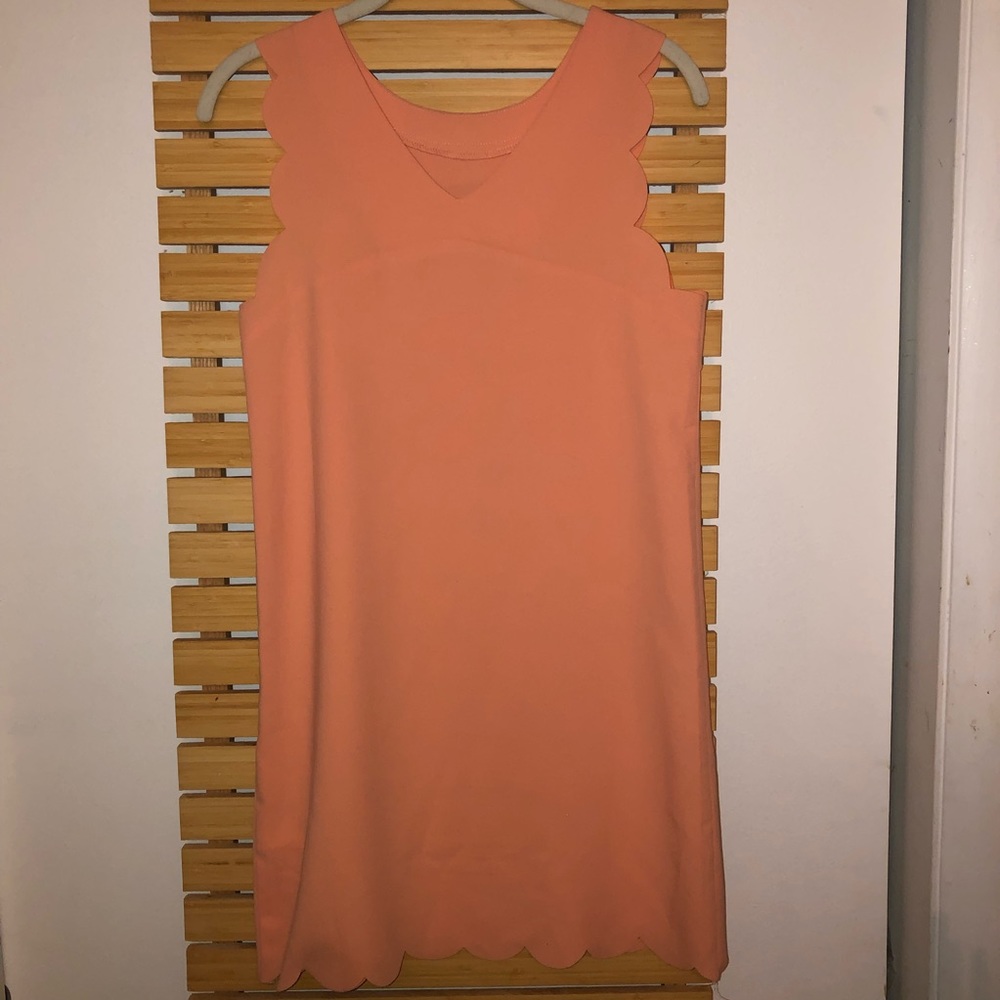 Peach scalloped dress.